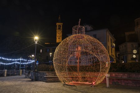 Laveno, Italy - 12-20-2022: Large sphere illuminated by colored Christmas lights in Lavenoのeditorial素材