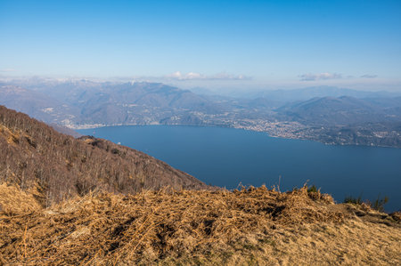 Aerial view of the Lake Maggiore with the Alps in the background from Pincavallo in Piedmontの写真素材