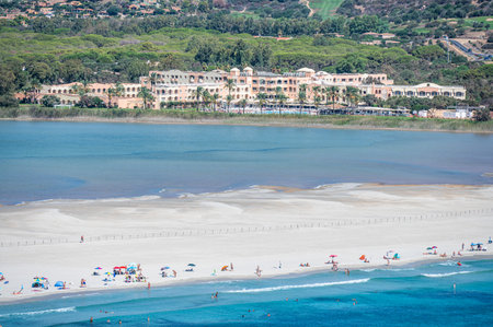 Aerial view of the beautiful beach of Porto Giunco in Villasimius with white sand and crystal clear water with the Notteri pond in the backgroundの写真素材