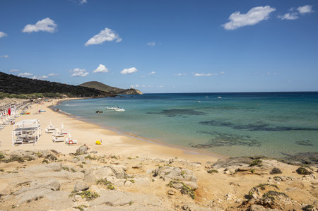Pula, Italy - 09-10-2024: Beautiful beach in Chia, in Southern Sardinia, with white sand and transparent and turquoise waterの写真素材