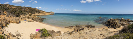 Wide view of the Beautiful beach in Chia, in Southern Sardinia, with white sand and transparent and turquoise waterの写真素材