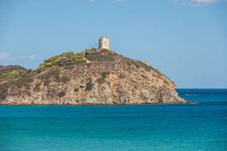 The Chia tower facing the beautiful turquoise sea of â€‹â€‹Sardinia