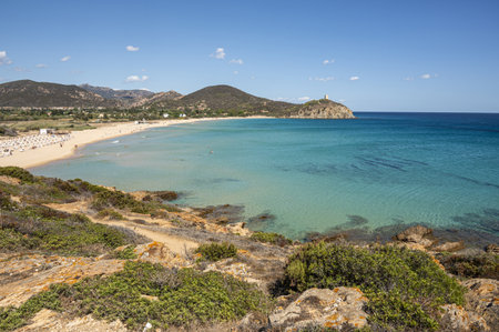 Pula, Italy - 09-10-2024: Beautiful beach in Chia, in Southern Sardinia, with white sand and transparent and turquoise waterの写真素材