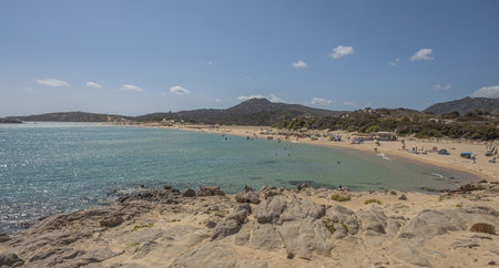 Pula, Italy - 09-10-2024: Beautiful beach in Chia, in Southern Sardinia, with white sand and transparent and turquoise waterの写真素材
