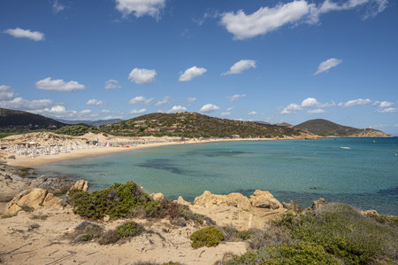 Pula, Italy - 09-10-2024: Beautiful beach in Chia, in Southern Sardinia, with white sand and transparent and turquoise waterの写真素材
