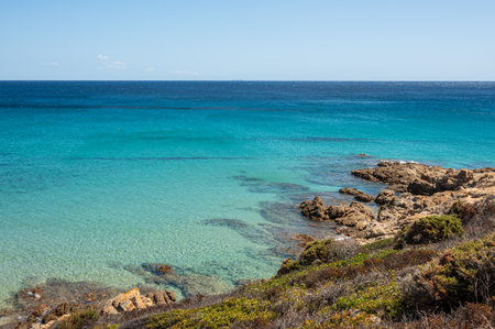 Beautiful beach in Chia, in Southern Sardinia, with white sand and transparent and turquoise waterの写真素材