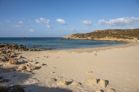 The beautiful beach of Cala Cipolla in Chia in Sardinia, with white sand and transparent and turquoise waterの写真素材