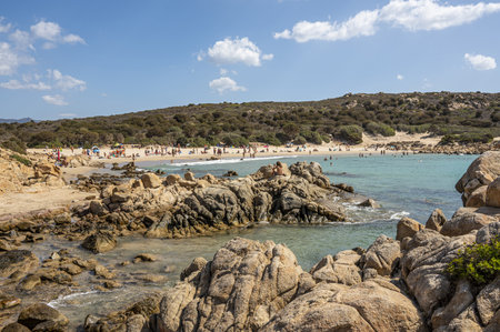 The beautiful beach of Cala Cipolla in Chia in Sardinia, with white sand and transparent and turquoise waterの写真素材