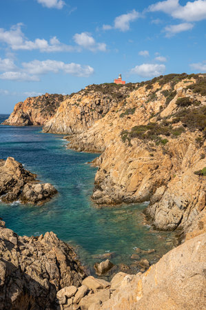 The beautiful Capo Spargivento in southern Sardinia with the red lighthouse dominating it from aboveの写真素材