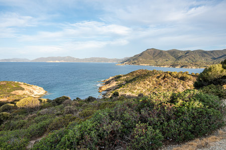 The beach of Sa Perda Longa in Sardinia with turquoise and blue waterの写真素材