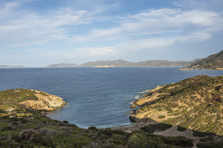 The beach of Sa Perda Longa in Sardinia with turquoise and blue waterの写真素材