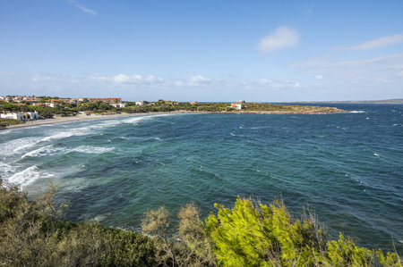 Coastline of Sant'Antioco Island with high red cliffs and rough seaの写真素材