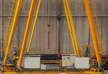 Yellow iron machinery in a factoryの写真素材