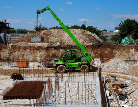 Telescopic handler crane at a new construction siteの写真素材