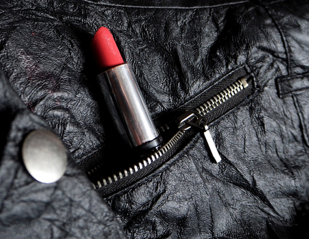 Red lipstick in a pocket of a jacketの写真素材