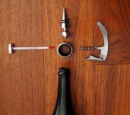 Wine taster kit. Wine tools on a wooden tableの写真素材