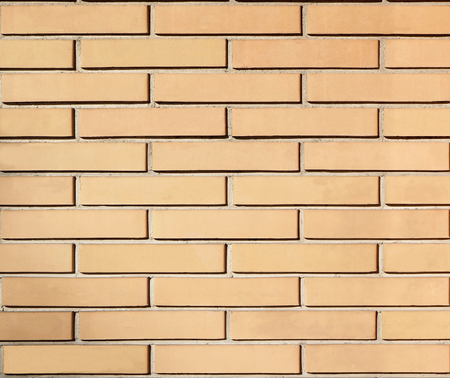 Wall with embossed yellow ocher bricksの写真素材
