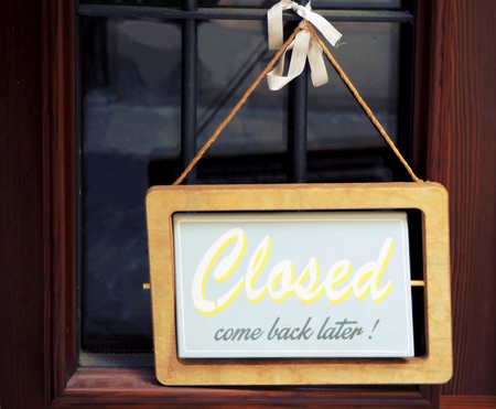 We are closed, like back later! Retro sign on the door of a shopの写真素材
