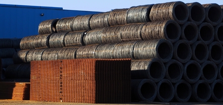 Iron and iron raw products outside the steel factory waiting to be send to buyersの写真素材