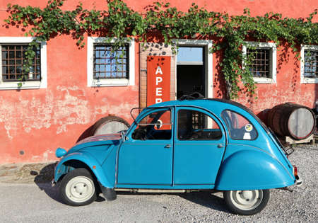 Pradamano, Italy. July 16,2019. Classic blue Citroen 2Cv Special parked outside a farmhouse after vintage car exhibition in summertimeのeditorial素材