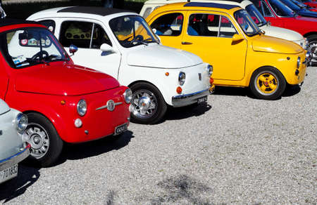 Percoto, Italy. March 24 2019. Bright vintage colorful Fiat 500s waiting to participate in an auto gathering laterのeditorial素材