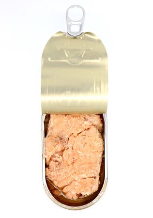 Canned salmon in a half-open tin on white backgroundの写真素材