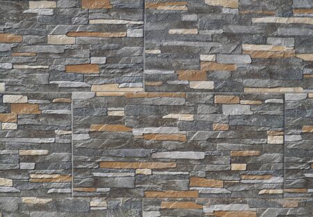 Exterior cladding wall made of stoneware with rocks effect. Background and texture.の写真素材