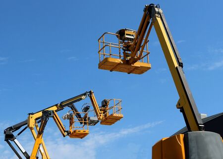 Back side of an aerial work platform, with other three in front of it.の写真素材
