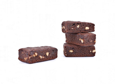 Mini brownies with hazelnuts on white background.の写真素材