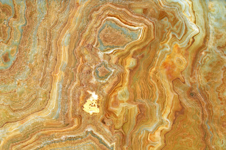 Onyx marble stone, crossed cut. Main colors are brown and green. Texture and background.の写真素材