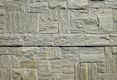Grayish green sandstone tiles for exterior walls. Background and textureの写真素材