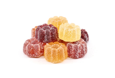 Jelly candies of various fruits flavor coated with sugar, on white backgroundの写真素材