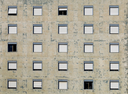 Peeling facade of an old abandoned apartment building. Background and texture.の写真素材