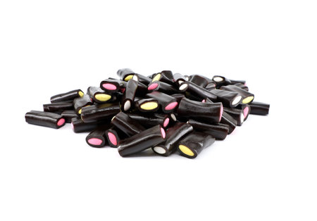 Licorice candy sticks with colorful fillings on white background.の写真素材