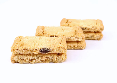 Rustic apple cake cookies with raisins on white backgroundの写真素材