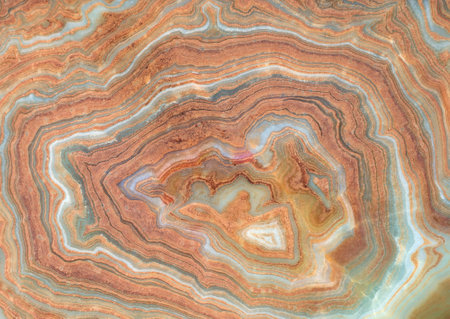 Onyx marble stone, crossed cut. Main color is brown with adds of green, white and red. Textures and backgrounds.の写真素材