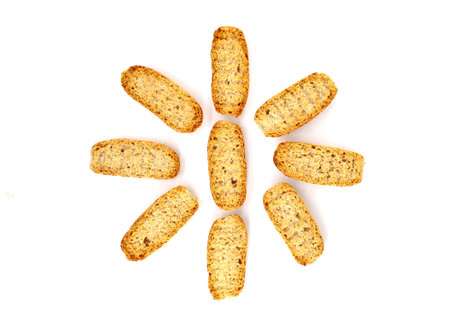 Oval slices of toasted bread used for Italian appetizers as Crostino or Bruschetta, then adding a topping above. White background.の写真素材