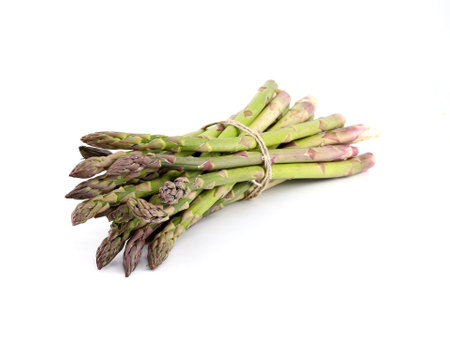 Bunch of green asparagus on a white background.の写真素材