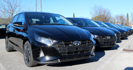 Tavagnacco, Italy. January 15, 2022. New models of black Hyundai i20 lined up outside the official dealership.のeditorial素材