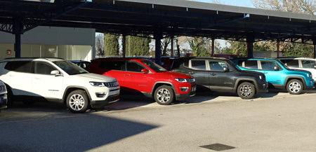 Cervignano, Italy. January 16, 2022. Brand new models of Compass and Renegade on display outside the official dealership of Jeep automaker.のeditorial素材