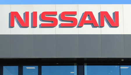 Reana, Italy. February 8, 2022. Nissan brand name on the the local dealership facade of the japanese automaker.のeditorial素材