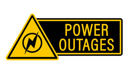 Power outages. Yellow triangle warning sign with symbol and text by sideのイラスト素材