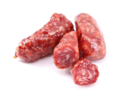 Wild boar salami on white background.の写真素材