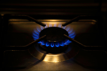 one flame a gas stovel in home cookingの写真素材