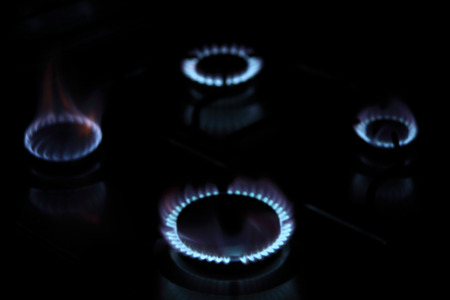 four flame a gas stovel in home cookingの写真素材