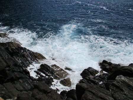 waves crashing on the rocks of the 5 lands, Liguria, Italy