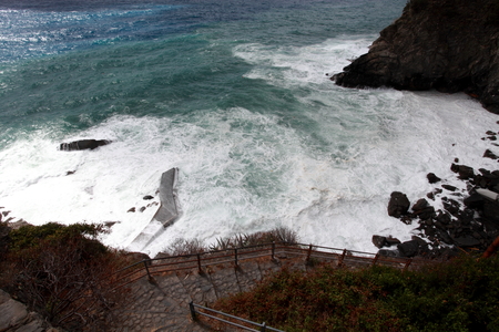 Waves crashing on the rocky coast of northern Italy dの写真素材