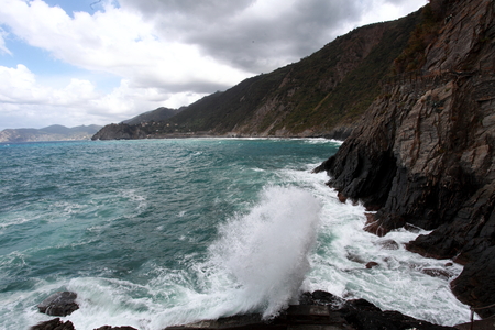 waves crashing on the rocky coastの写真素材