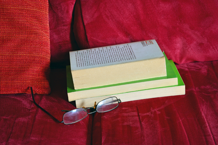 read an old book at homeの写真素材