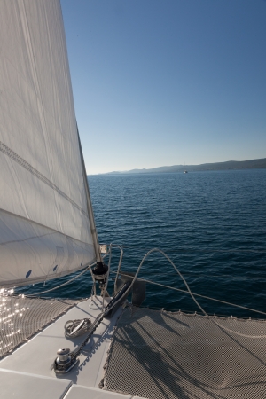 Part of white yacht with sail on the open ocean  Nobody  Cloudy blue sky の写真素材